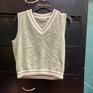 green sweater vest